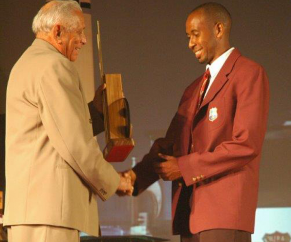 Ian Bradshaw collects First Class Player of the Year on behalf of Ridley Jacobs